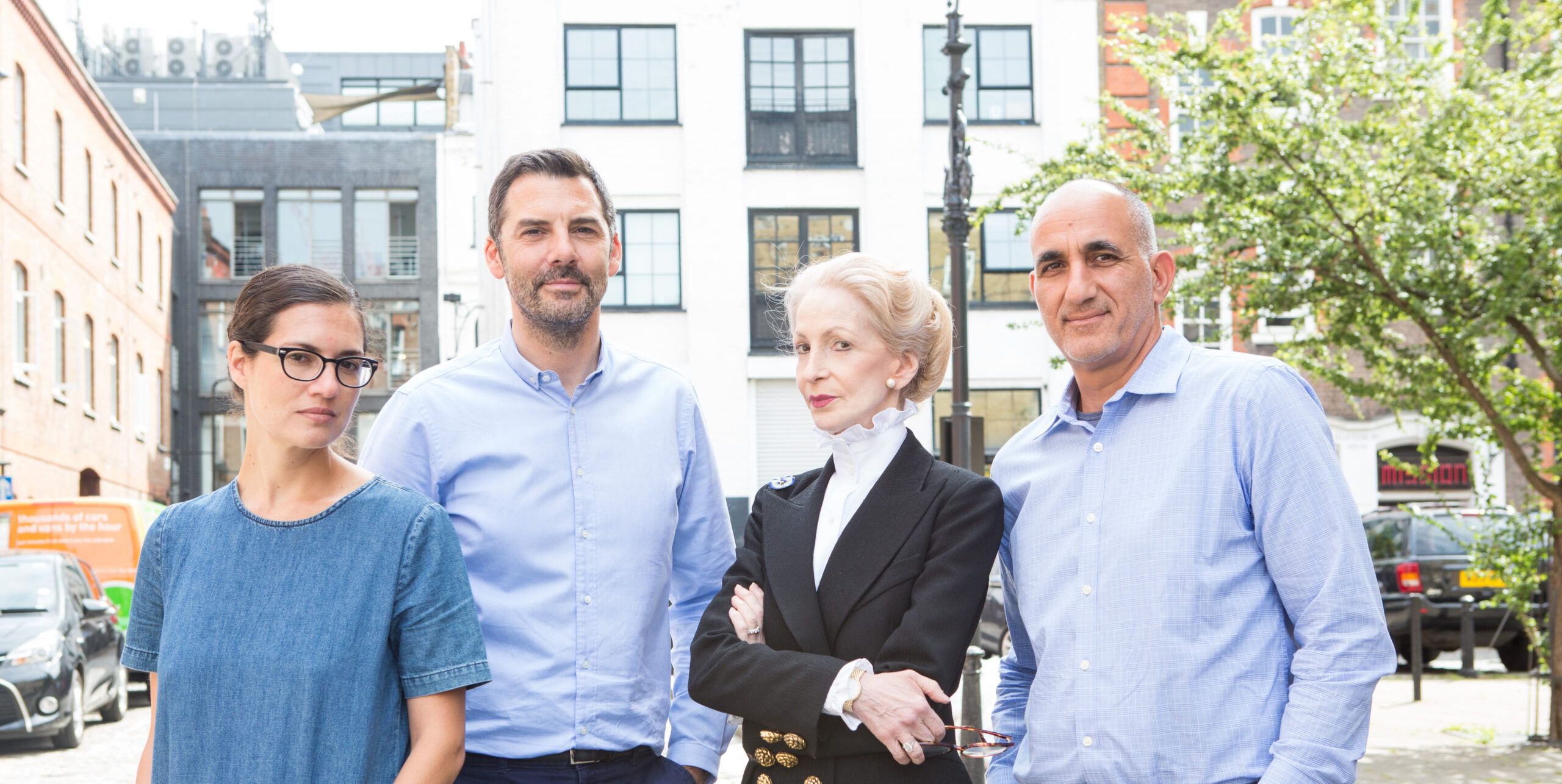 business professionals, urban setting with diverse group, confident expressions and stylish outfits