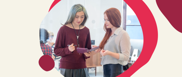 women collaborating, digital device interaction