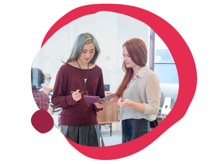 young women collaborating in a modern office setting, engaging with a tablet and discussing ideas, business collaboration, teamwork