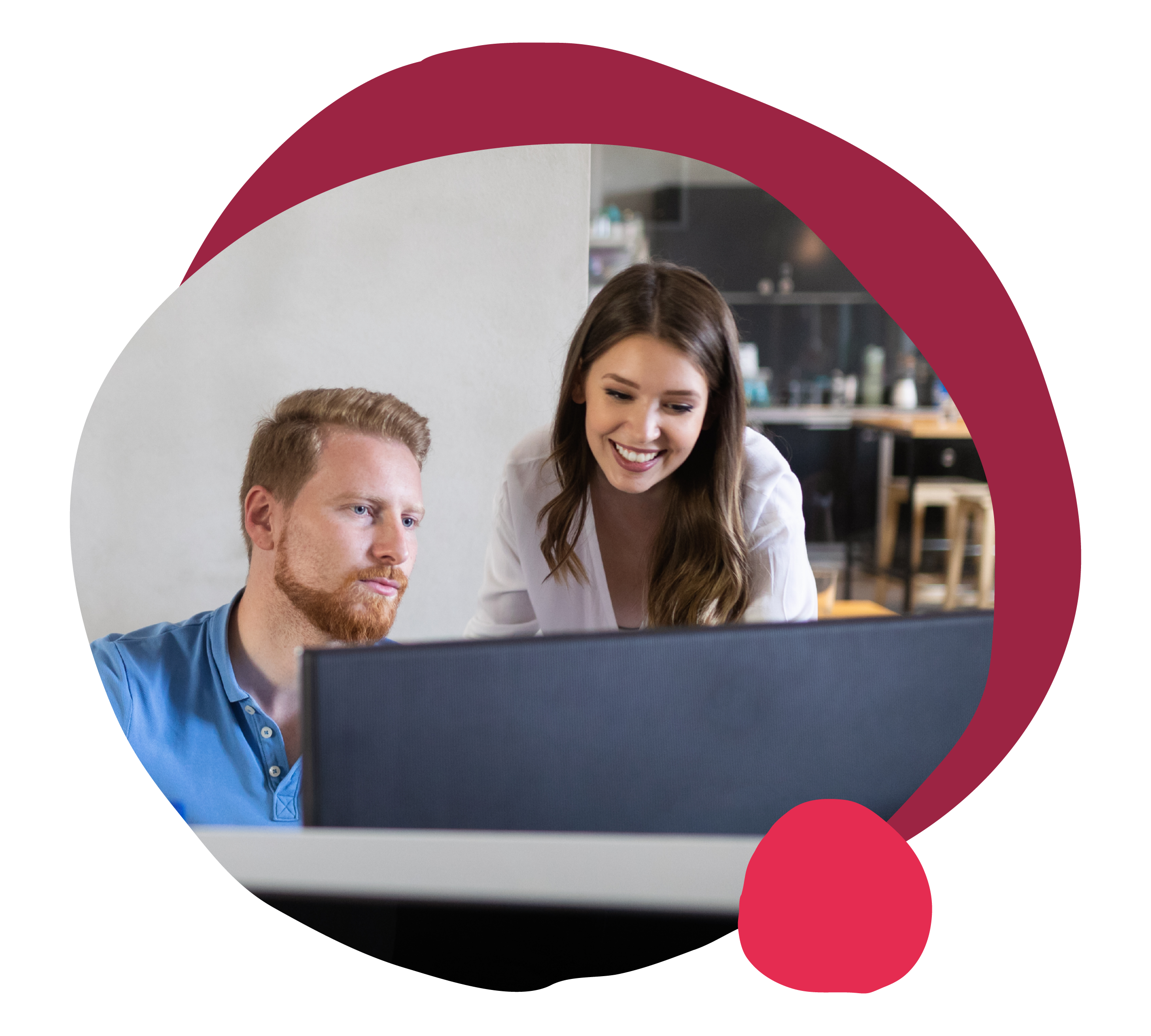 people collaborating in a modern workspace, smiling woman showing insights to focused man on computer screen
