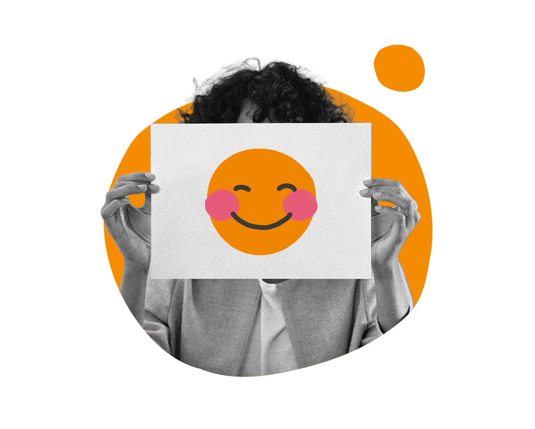 smiling emoji held by hands in front of a colorful background, person showing cheerful expression with artful design