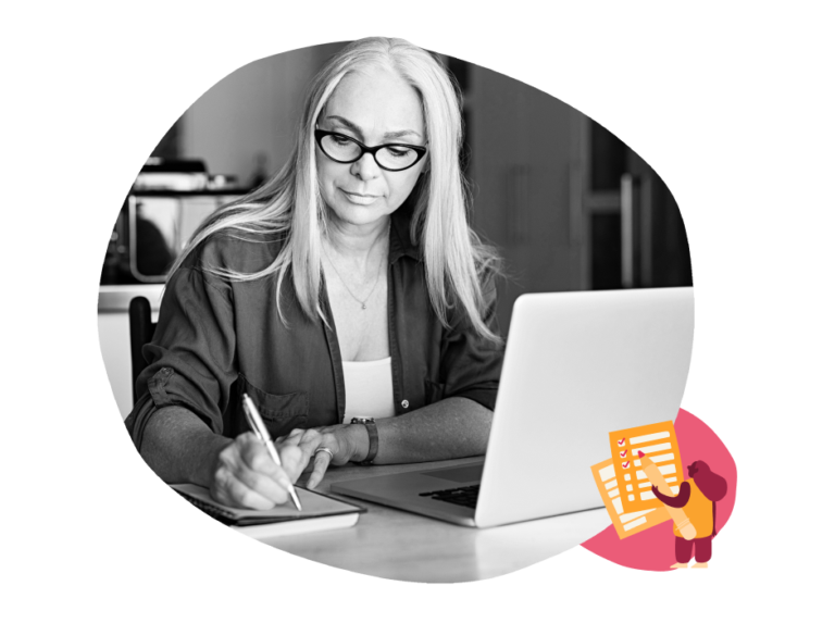 woman writing in notebook, laptop on table with creative icons