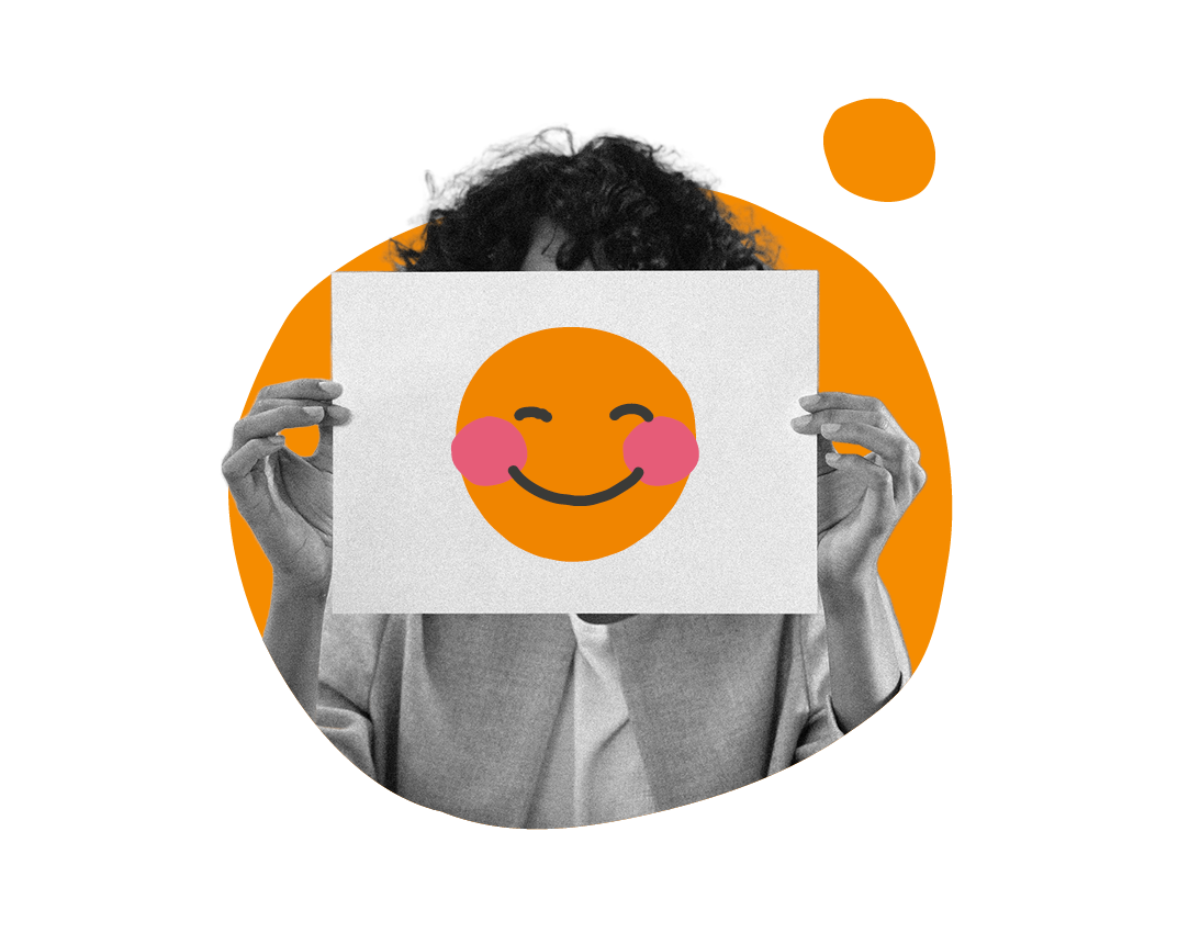 smiling emoji held by hands in front of a colorful background, person showing cheerful expression with artful design