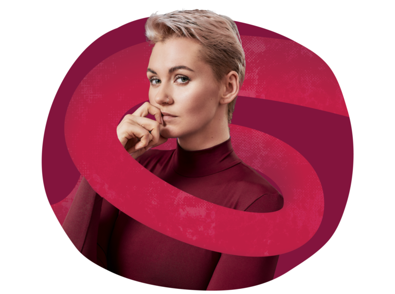 stylish person in maroon turtleneck, posing thoughtfully with finger on chin, against vibrant abstract background, thoughtful expression with short blonde hair and nose ring, highlighting modern fashion and creativity