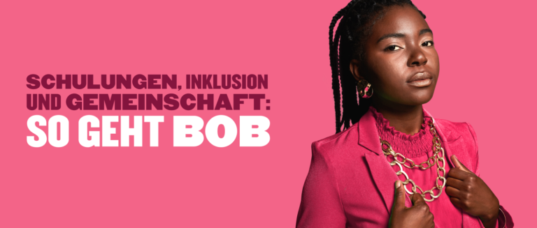 model in pink blazer on pink background with accessories and text about inclusion and community training, bold fashion statement with vibrant colors