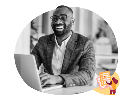 smiling businessman in a gray blazer working on a laptop at a desk, modern office setting with cheerful atmosphere and documents