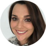 smiling woman with brown hair and makeup, close-up portrait in round frame, casual attire, warm expression