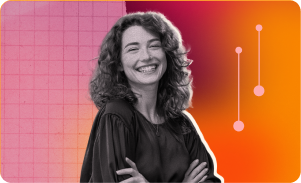smiling woman with curly hair in black attire against colorful abstract background, cheerful expression with vibrant design elements