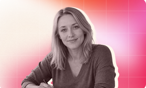 smiling woman with long blonde hair in a gray sweater, seated with a pen, against a vibrant pink gradient background, professional portrait with colorful backdrop