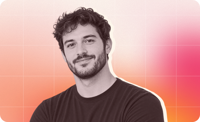 smiling man with curly hair against a gradient background; wearing a black shirt, presents a friendly demeanor, portrait of a young man in a casual setting
