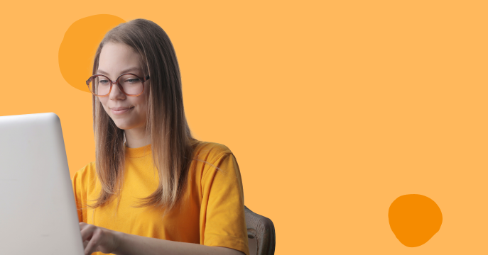 young girl wearing glasses using a laptop, bright orange background, smiling, engaged in online activity, girl_with_laptop, orange_background