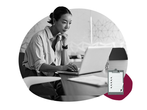 HR professional reviewing a payroll implementation plan on a laptop, beside a checklist clipboard icon